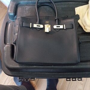 Hermes Elegant Black Shoulder Bag with Gold Details